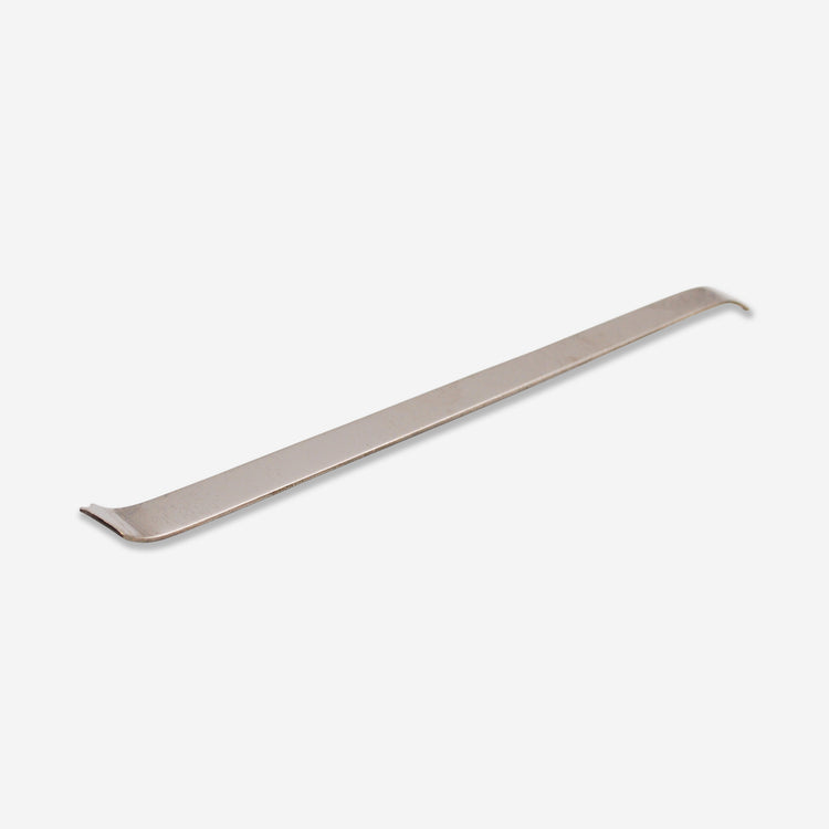 A brass tool that can be used to make dragon scale texture when used repetitively.