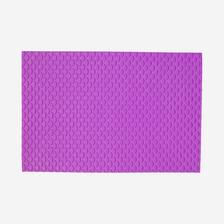 Textured mat that has a dragon scale pattern.