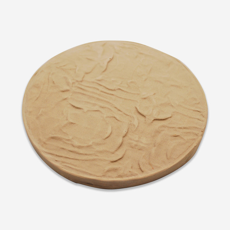 Textured mat that has a wrinkled cloth pattern.