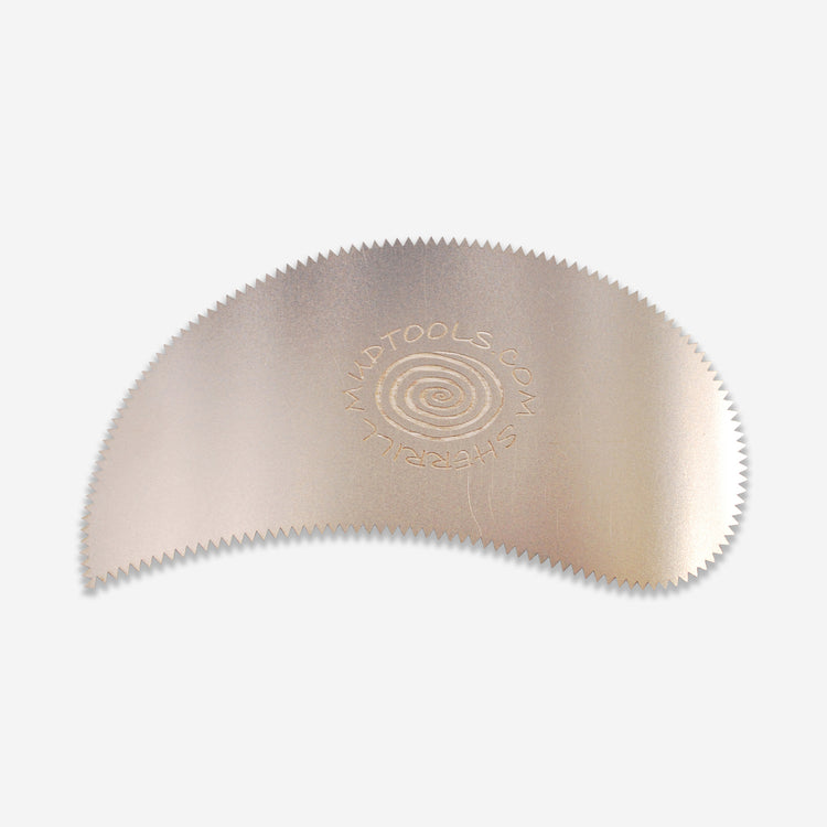 This is the Paisley Scraper Rib with 18 teeth. Paisley Scraper proves itself indispensable for sculpting, shaping, and refining leather hard clay. The tight inside radius is good for working around joints (for example, at the inside of a teapot spout.)
