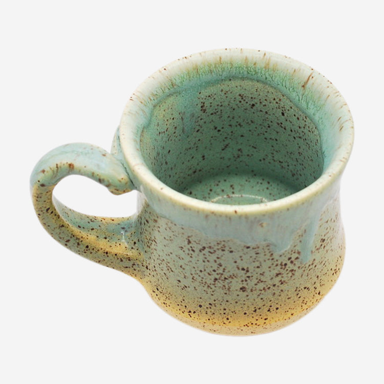 Teal Drippy Mug by Robbie Torres