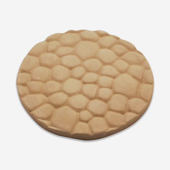 Textured mat that has a rock pattern.