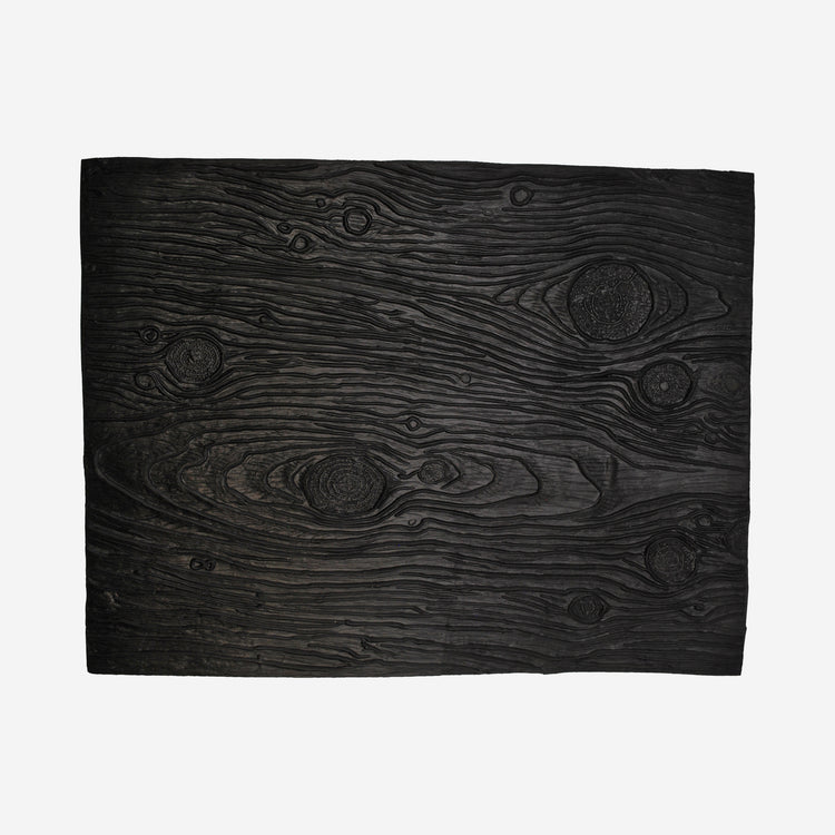 Textured mat that has a wood grain pattern.