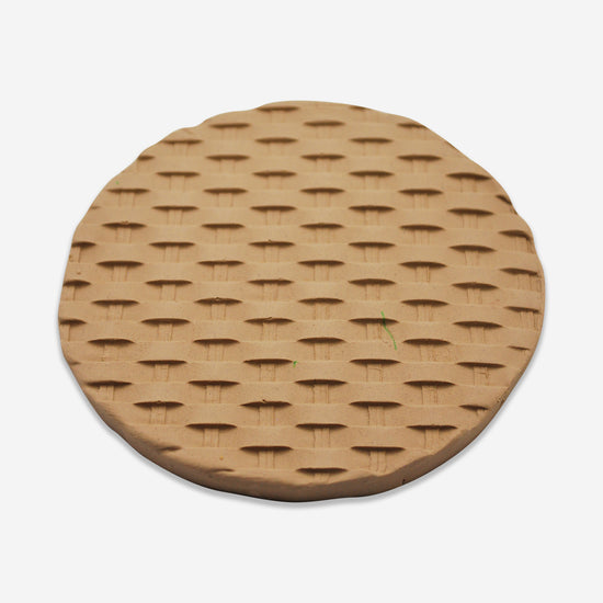 Textured mat that has a basket weave pattern.