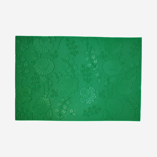 Textured mat that has a floral pattern.