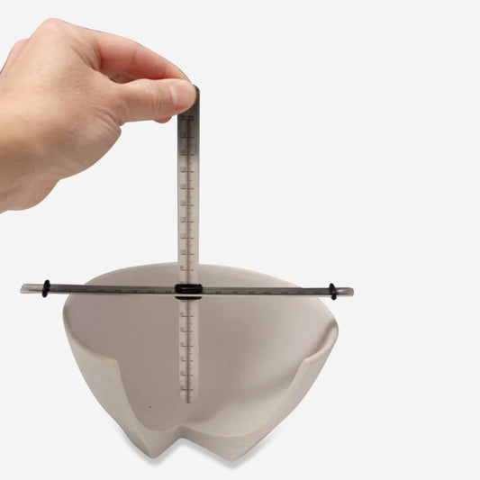 This small two piece measuring tool is designed for more precise measurements while trimming and throwing sets of pots.