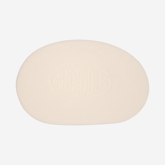 White mudsponge is a less absorbant synthetic sponge shaped like a potters rib that is used for finishing up final details on greenware.
