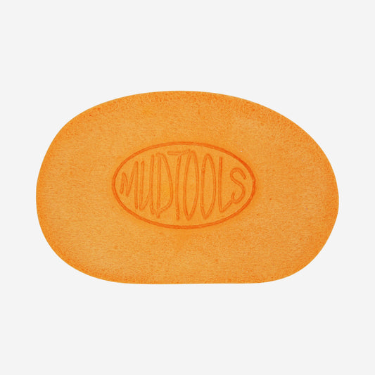 Orange mudsponge is a very absorbant synthetic sponge shaped like a potters rib that is used for throwing on the wheel.